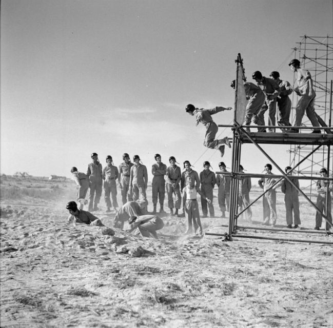 SAS volunteers jumping from steel gantries while undergoing parachute training at Kabrit, Egypt.