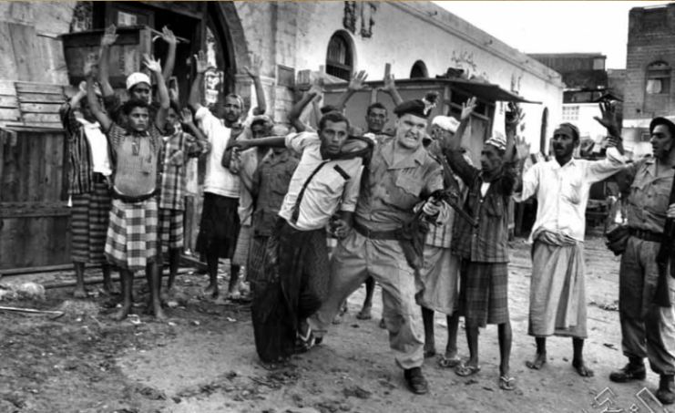 British soldier arresting one of the rebels of the sons of Aden anti-occupation