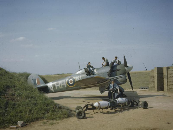 Typhoon Ib EK139 N “Dirty Dora” of 175 Sqn. being armed with “500 lb” concrete practice bombs in late 1943.