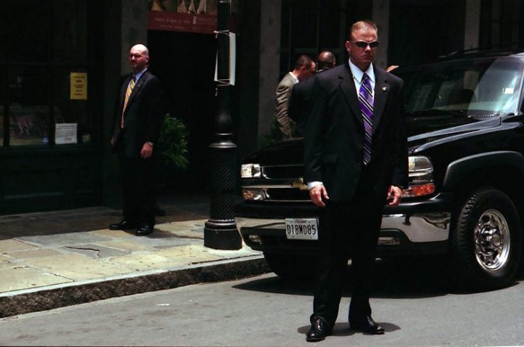 U.S. Secret Service agents guarding the former First Lady Laura Bush. Photo: Chuck Patch / CC BY-SA 2.0