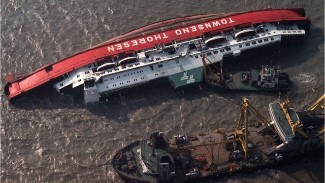 The MS Herald of Free Enterprise on her side half-submerged.1987