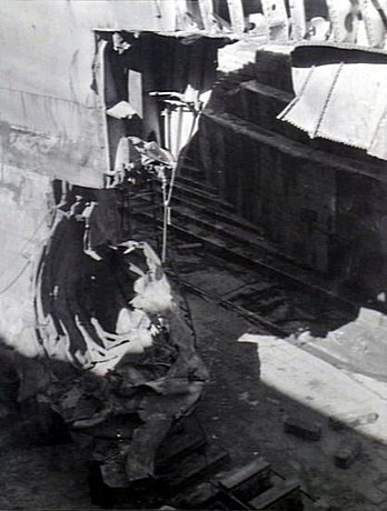 The U.S. Navy heavy cruiser USS Chicago (CA-29) in drydock at Cockatoo Island Dockyard, Sydney (Australia), showing her damaged bow after damage sustained when torpedoed in the course of the Battle of Savo.