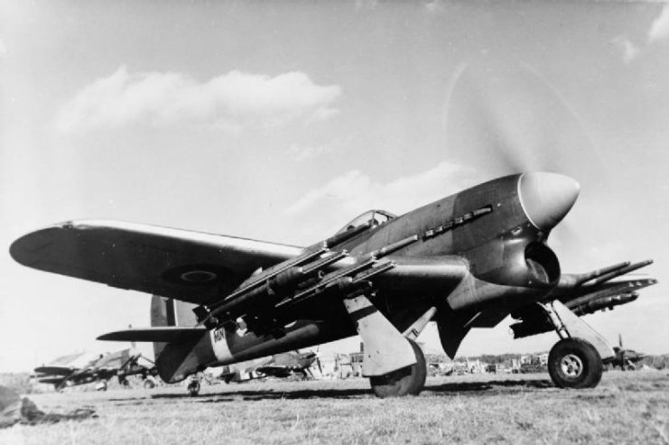 A Royal Air Force Hawker Typhoon Mark IB with a full load of 60-lb. rocket-projectiles beneath the wings