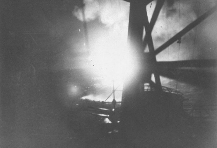 View from the Japanese cruiser Chokai during the battle as aerial flares illuminate the Allied southern force.