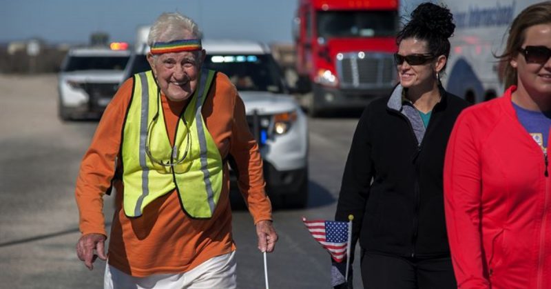 STERLING CITY, Texas -- Ernie Andrus, Navy World War II veteran, runs through Sterling City with locals March 26. Andrus is running coast to coast in hopes to raise enough money to return the USS LST-325, a tank landing ship, to Normandy for the 2019 D-Day memorial service. (U.S. Air force photo/ Airman 1st Class Devin Boyer)