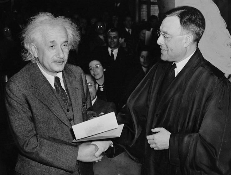 Albert Einstein receiving from Judge Phillip Forman his certificate of American citizenship.