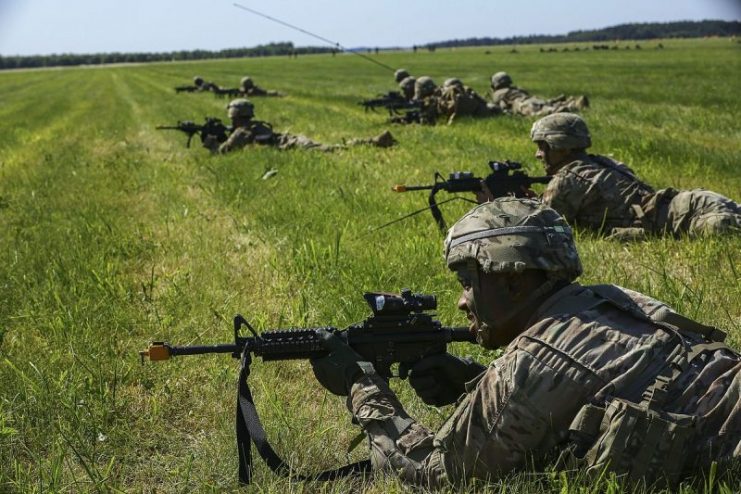 U.S. Army paratroopers from the 173rd Airborne Brigade return fire on the drop zone during training in Swedwin, Poland, Anakonda 2016 (a Polish-led multinational exercise).