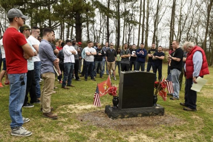 Airmen from Airman Leadership School class 16-C gather around the grave of the youngest American who lost his life in the Vietnam War, Private First Class Dan Bullock, March 12, 2016, in Goldsboro, North Carolina. (U.S. Air Force photo/Airman Shawna L. Keyes)
