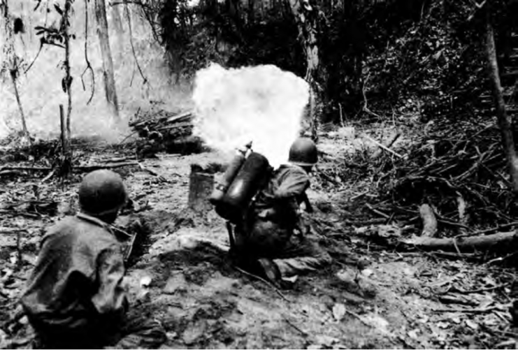 An M1A1 flamethrower being fired against a Japanese Bunker, Bougainville, March 1944