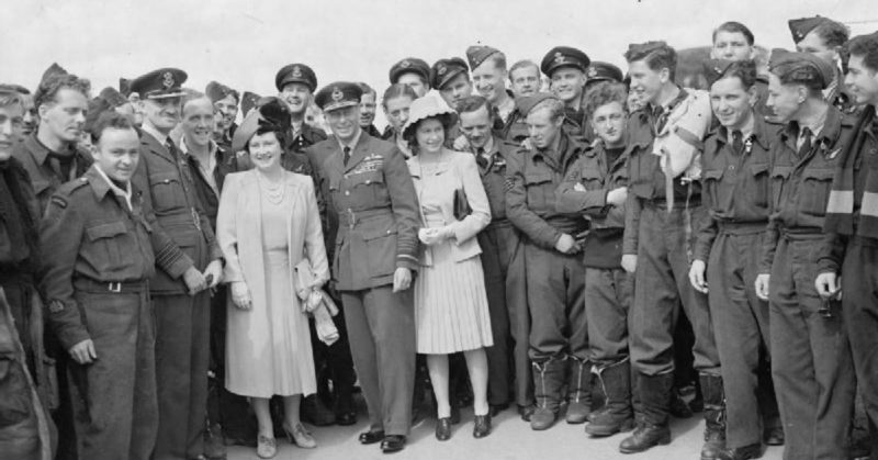 George VI, Queen Elizabeth, and Princess Elizabeth standing with a group of RAF personnel
