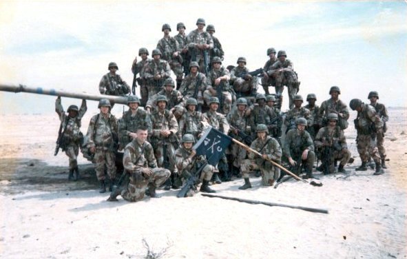 Soldiers of 2nd Platoon, Company C, 1st Battalion, 41st Infantry Regiment pose with a captured Iraqi tank, February 1991.Photo: Fury 1991 CC BY-SA 4.0