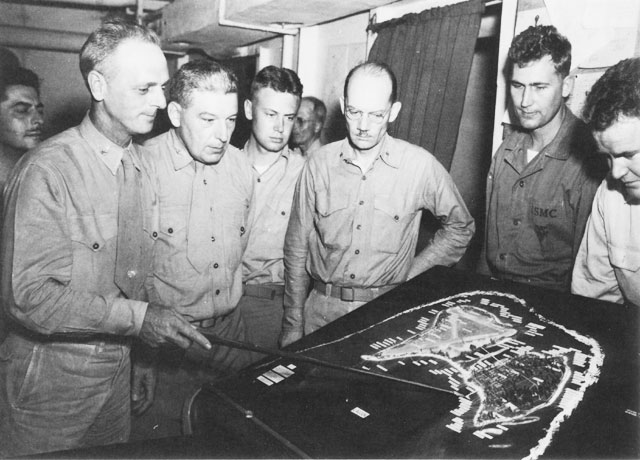 Col Franklin A. Hart (left), commander of the 24th Marines, briefs his staff on the operation plan for the invasion of Roi-Namur.