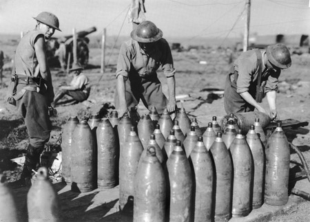 Men of the Australian Heavy Artillery capping 8-inch shells with ‘106’ (instantaneous) fuses.