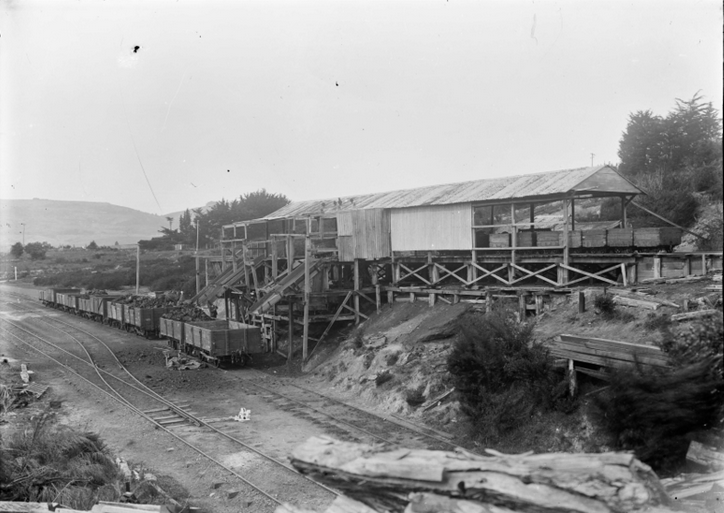 Coal being loaded into railway wagons through chutes