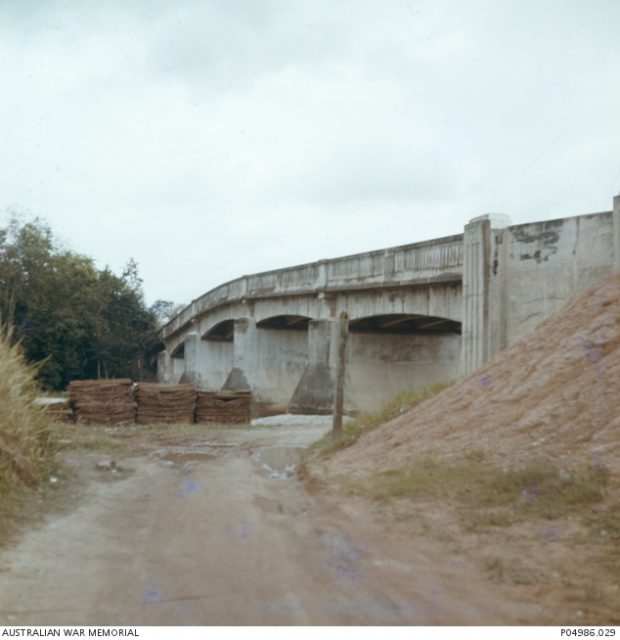 Parit Sulong Bridge in 1963. A memorial plaque commemorating fallen Allies was erected there that same year. The bridge was demolished in 1994 and replaced with a new one.