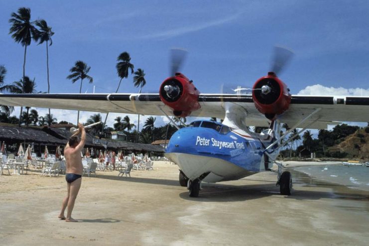 Brazil, Salvador de Bahia, Catalina PBY-5A hydroplane landing on beach.