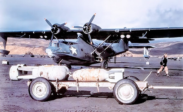 PBYs on an Aleutian Airfield around 1942, with bombs and anti-submarine depth charges on a trolley, ready for underwing mounting.This photo is taken from my book, page 44, chapter “The Wartime Years”.