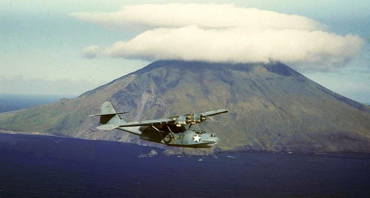 Magnificent shot of a US Navy PBY-5A on patrol over the Aleutian Islands, on the borderline of the Barents Sea and the Pacific Ocean. In extreme weather conditions, the Catalinas flew at low temp, low altitude, often in mist and fog.