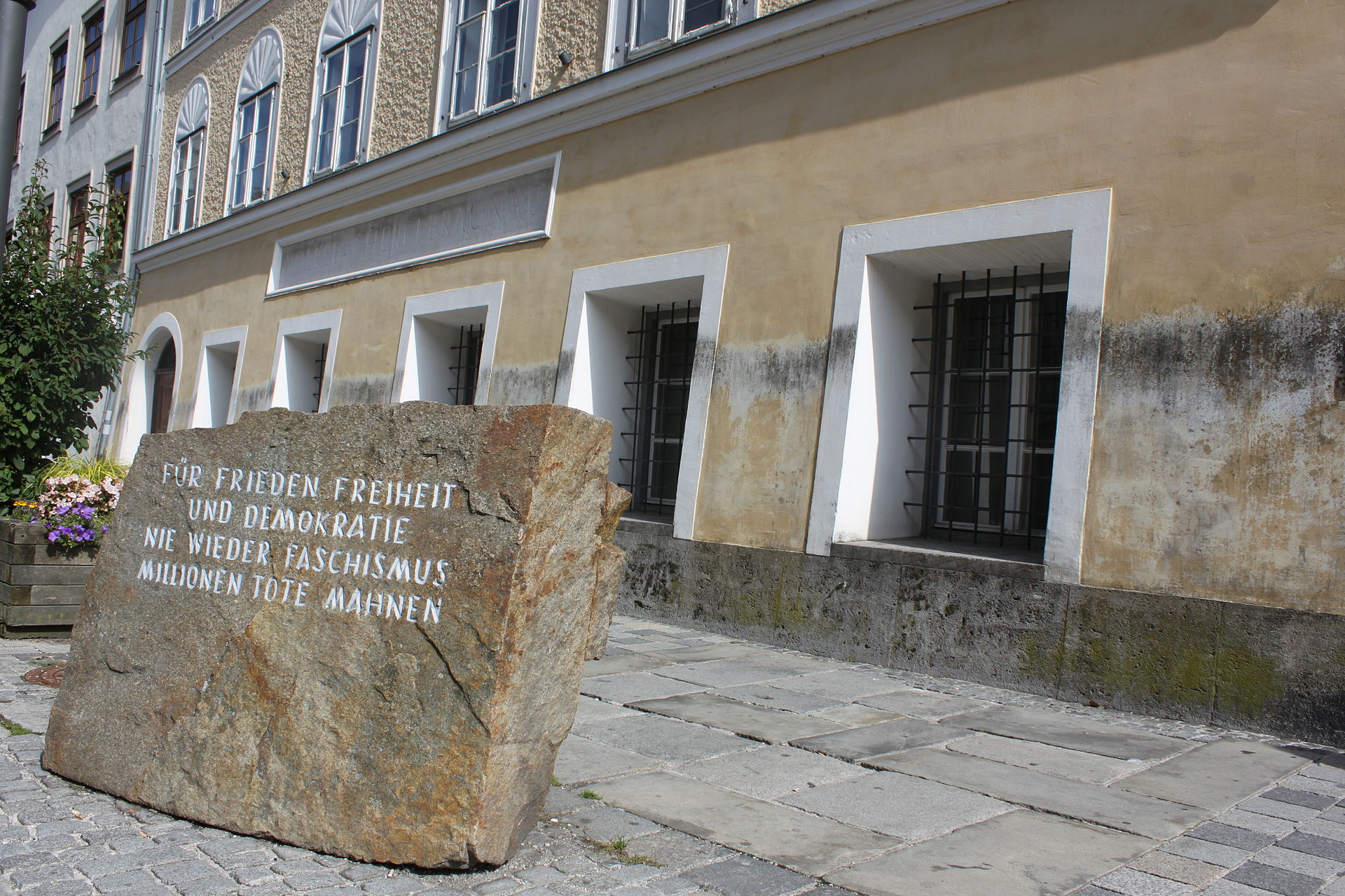 Where Hitler was born, a block of stone from the Mauthausen concentration camp. It reads 