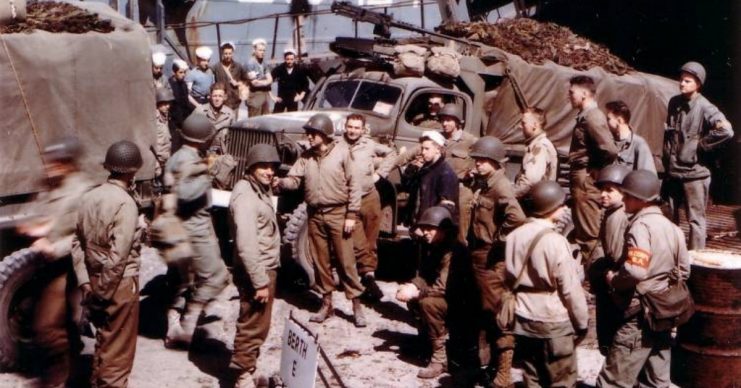 American troops load onto landing craft at a port in Britain from where they will shove off for the invasion of Europe on D-Day. Undated – June 1944.