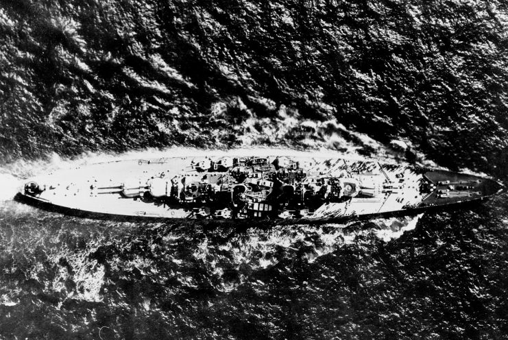 Overhead view of the Royal Navy battleship HMS Vanguard (23) underway.