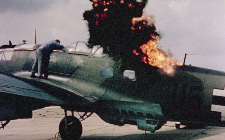 Still from amateur footage taken by Prince William of Gloucester at the Battle of Britain (1969) setat RAF Duxford. This shot shows a crew member testing pyrotechnics on a CASA 2.111 in the place of a Heinkel He 111. Photo: IWM (MGH 2434)