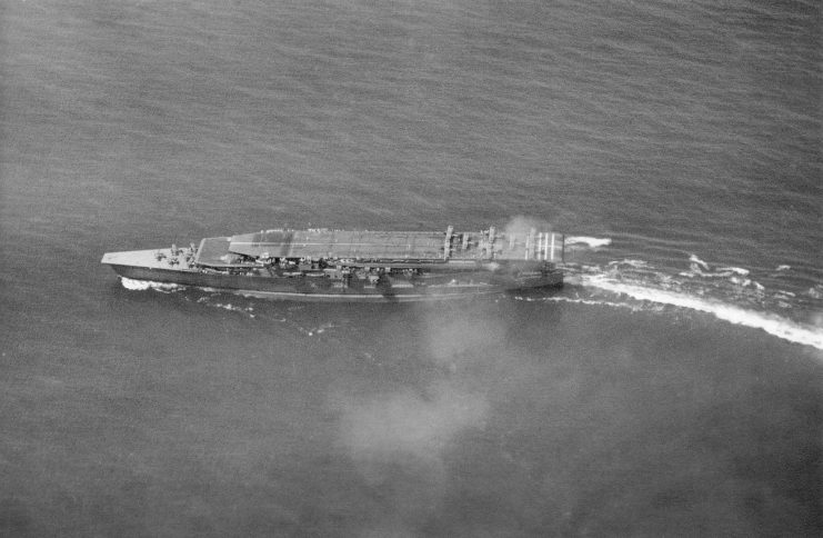Kaga conducting air operations in 1930. On the upper deck are Mitsubishi B1M torpedo bombers preparing for takeoff. Nakajima A1N Type 3 fighters are parked on the lower deck forward.