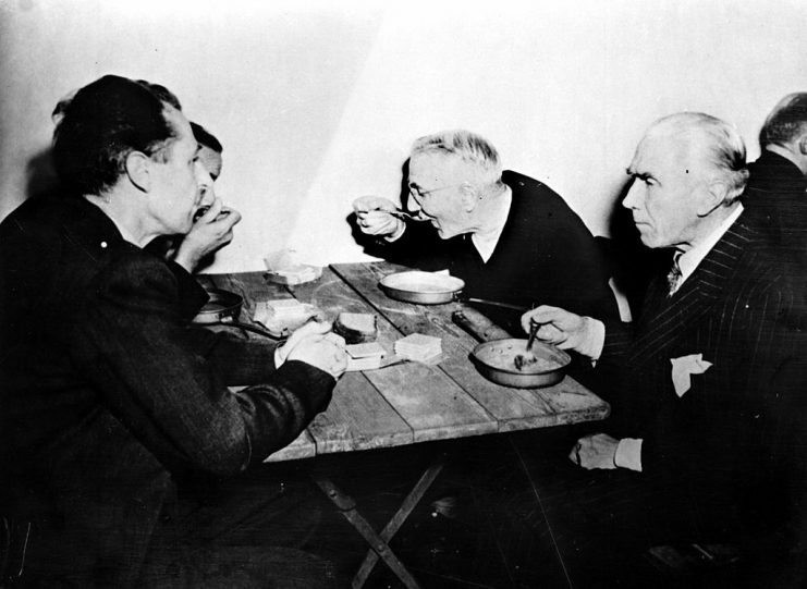 GERMANY – CIRCA 1945: World War II. Nuremberg trials. Fritzsche, Schacht and von Papen lunching in their prison. (Photo by Roger Viollet via Getty Images)