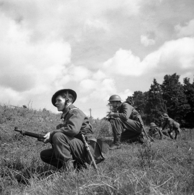 Home Guard soldiers advance warily during an exercise near Exeter, 10 August 1941.