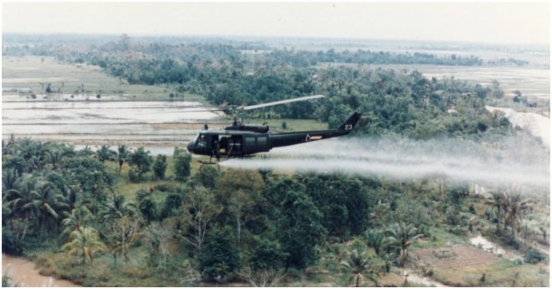 Huey helicopter spraying Agent Orange over Vietnam.