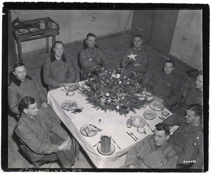 Brig. Gen. Anthony McAuliffe and his staff gathered inside Bastogne’s Heintz Barracks for Christmas dinner Dec. 25th, 1944. This military barracks served as the Division Main Command Post during the siege of Bastogne, Belgium during WWII. The facility is now a museum known as the “Nuts Cave”. (Photo Credit: U.S. Army)
