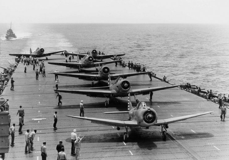 SBD Dauntless dive bomber & TBD Devastator torpedo bombers prepare to take off from the USS Enterprise (CV-6).