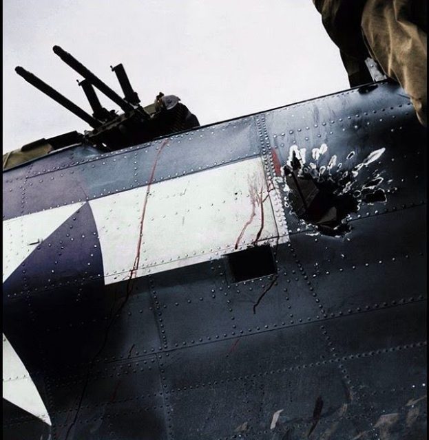 Douglas SBD Dauntless dive-bomber onboard the USS Saratoga, 5 November 1943. Rear gunner killed by 20mm round from a Japanese A6M Zero during the raid on Rabaul.The gunners hands were still clasped to the .30 caliber machine guns.