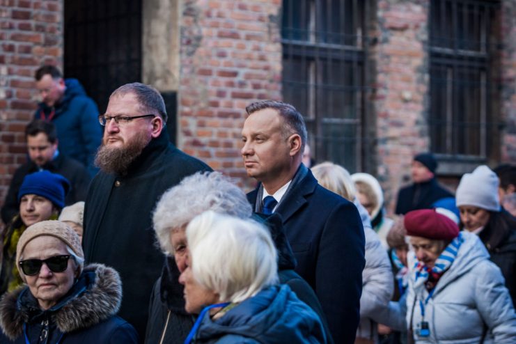 President of Poland, Andrzej Duda, center, attends the floral tribute in the extermination block 11 of the Auschwitz concentration camp for the 75th anniversary of its liberation on 27 January 2020 in Oswiecim, Poland. (Photo by Celestino Arce/NurPhoto via Getty Images)