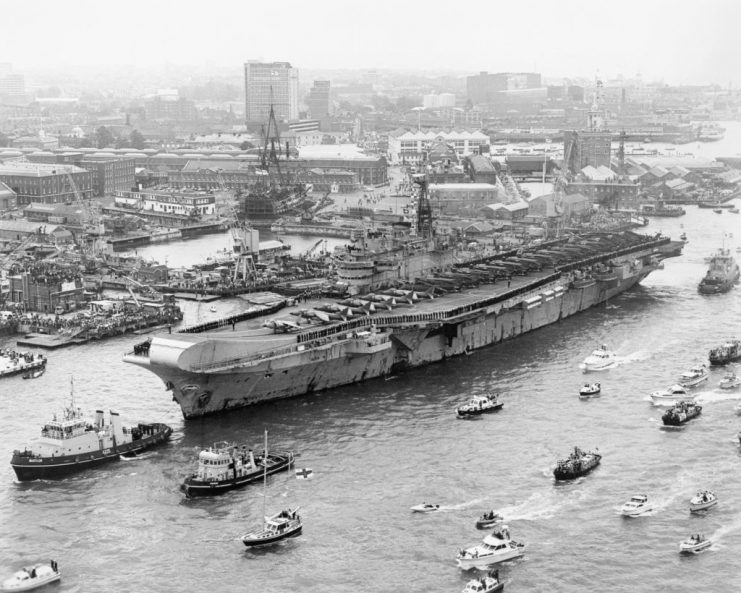 The Falklands Conflict, April – June 1982, HMS HERMES passes HMS VICTORY as she enters Portsmouth harbour on returning from the Falklands war on 21 July 1982. (Photo by Royal Navy Official Photographer/ Crown Copyright. Imperial War Museums via Getty Images)