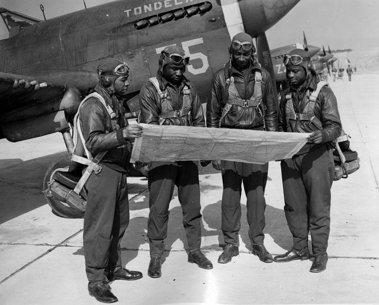 Tuskegee Airmen Pearlee E Saunders, Leroy Bowman, William M Gordon and Lloyd Singletary studying maps before flying a fighter plane at Tuskegee Army Flying School, Tuskegee, Alabama, 1942. (Photo by Afro American Newspapers/Gado/Getty Images)