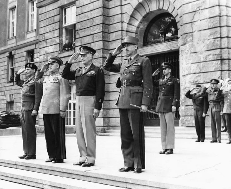 Allied leaders at the end of World War Two: (L-R) Field Marshal Viscount Montgomery, Marshal Zhukov, General Dwight Eisenhower and General Koenig, saluting as allied flags are raised, Berlin, September 4th 1945. (Photo by Keystone/Hulton Archive/Getty Images)