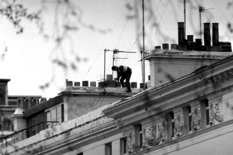 Armed Police on the roof of the Embassy. (Photo by PA Images via Getty Images)
