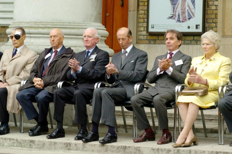 The Duke of Kent applauds the Band of the Grenadier Guards whilst seated next to Earl Alexander (2nd right), Viscount Montgomery (2nd left) and the youngest daughter of Sir Winston Churchill, Lady Soames.  (Photo by Johnny Green – PA Images/PA Images via Getty Images)