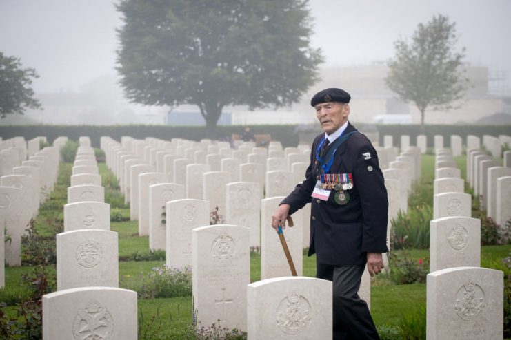 BAYEUX, FRANCE – JUNE 06: Normandy veteran 98-year-old Edwin ‘Ted’ Hunt walks past the graves of the fallen as Normandy veterans attend a official service of remembrance at Bayeux Cemetery. Matt Cardy/Getty Images