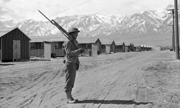 May 23, 1943, an American soldier guards the Japanese-American internment camp at Manzanar, California