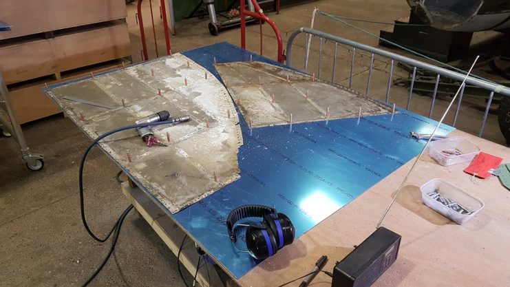 Two more Lancaster wing tip skins being produced. You can see the scale of corrosion we’ve faced on the inside of these skins (Note the Mosquito in the background…).