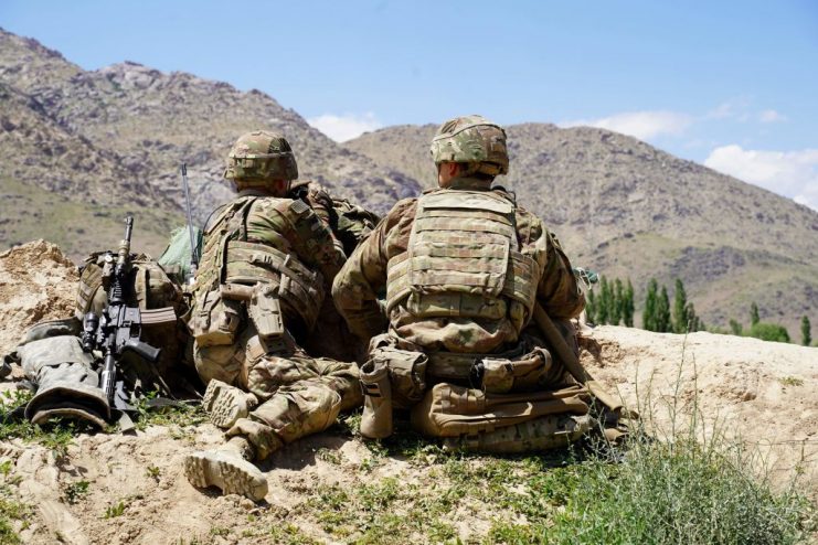 US soldiers look out over hillsides during a visit of the commander of US and NATO forces in Afghanistan General Scott Miller at the Afghan National Army (ANA) checkpoint in Nerkh district of Wardak province.  THOMAS WATKINS/AFP via Getty Images