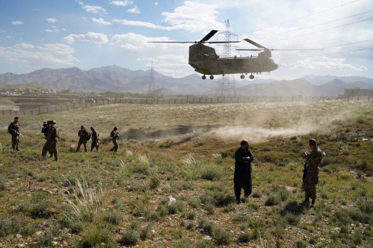 In this photo taken on June 6, 2019, a US military Chinook helicopter lands on a field outside the governor’s palace during a visit by the commander of US and NATO forces in Afghanistan, General Scott Miller, and Asadullah Khalid. THOMAS WATKINS/AFP via Getty Images