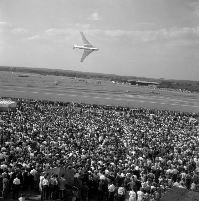 A crowd watching a wheeling Handley Page Victor bomber during the the Society of British Aircraft Constructors’ annual Flying Display and Exhibition at Farnborough in Hampshire. (Photo by PA Images via Getty Images)