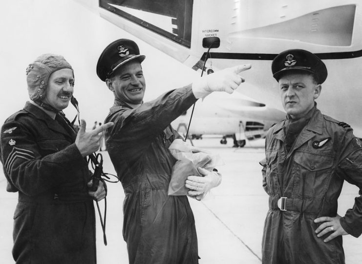 From left to right, Chief Technician Alan Algeo, Station Commander James Edgar Johnson (1915 – 2001), aka Johnnie Johnson and Flight Lieutenant James Bannister pose next to a Handley Page Victor at RAF Cottesmore, 11th September 1958. The Handley Page Victor is the third and final V Bomber to enter service with the RAF. (Photo by Ron Case/Keystone/Hulton Archive/Getty Images)