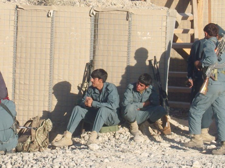 ANP men rest with British forces.