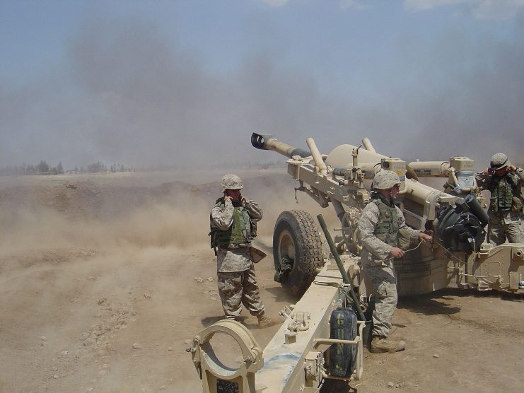 Marines from A/1/11 firing their M198 Howitzer