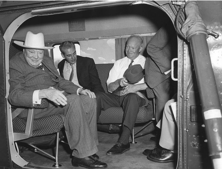 British former Prime Minister Winston Churchill (1874 – 1965) (in white hat) and US President Dwight Eisenhower (1890 – 1965) (in white shirt) sit on a helicopter, Gettysburg, Pennsylvania May 6, 1959. The men had been visiting the Presidents home and were due to return to Washington. (Photo by Abbie Rowe/PhotoQuest/Getty Images)
