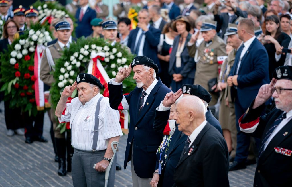 31 July 2019, Poland, Warsaw: Veterans and contemporary witnesses salute the monument at the commemoration ceremony for the 75th anniversary of the Warsaw Uprising. Photo: Kay Nietfeld/dpa (Photo by Kay Nietfeld/picture alliance via Getty Images)